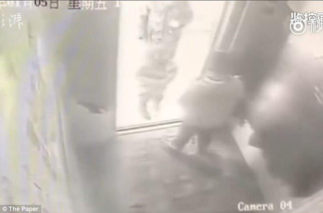 CCTV footage shows Ming Ming taking a lift as he left home with his mother's phone in China