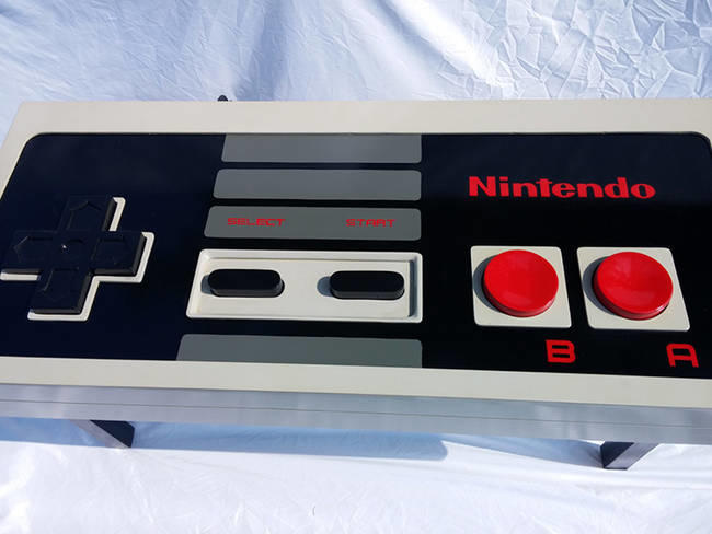This table is handmade and was crafted to the exact specs of the NES controller. Only, you know, a lot bigger.