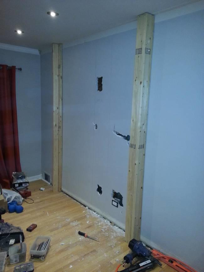 Here's the start of the project - a blank wall, a couple holes, and a wooden frame.