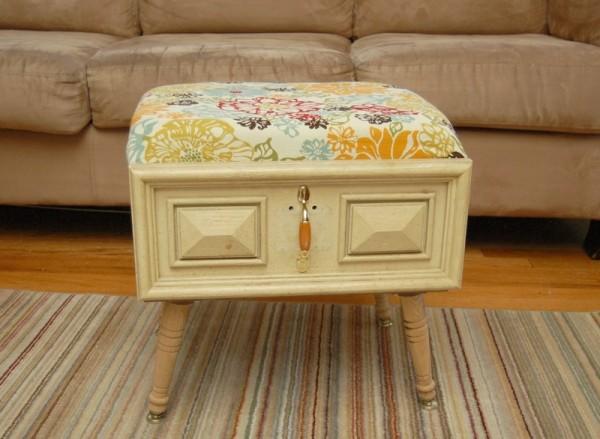 Finally, she added table legs to make a really cute ottoman that you can store things inside or rest your feet upon!