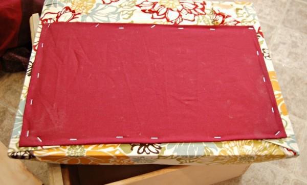 She added another square piece of fabric and folded the edges under to hide any raw edges. 