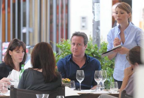 epa02852924 British Prime Minister David Cameron (R) and his wife Samantha (L) are having lunch in a restaurant in Arezzo, Tuscany region, Italy, 02 August 2011. The prime minister and his family are spending a two-week vacation in Tuscany.  EPA/ALESSANDRO FALSETTI