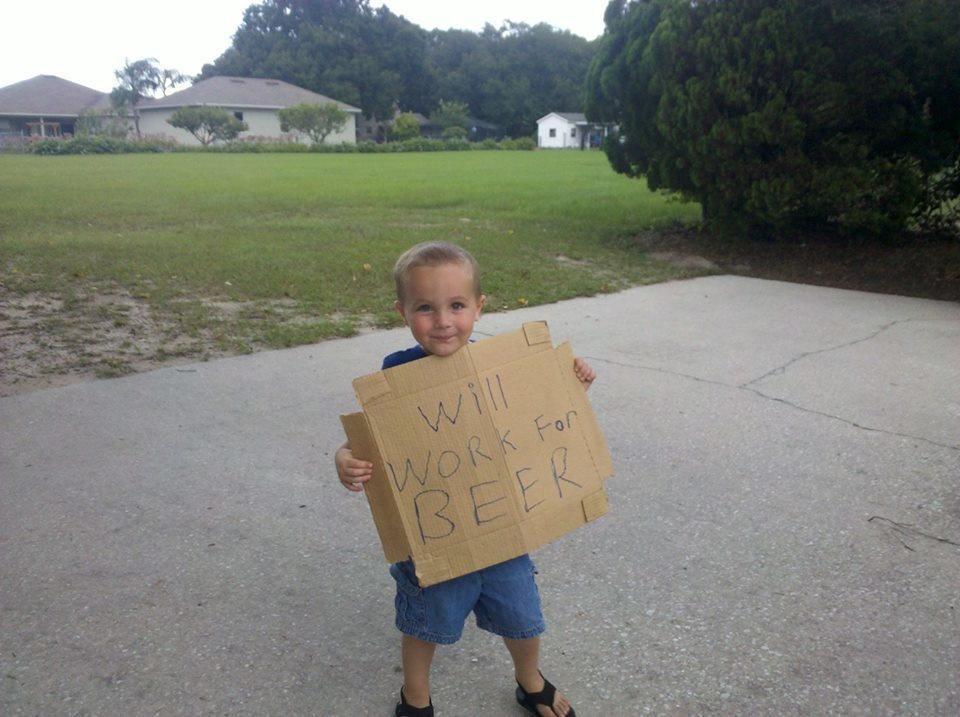 This little dude found this sign lying in a field.