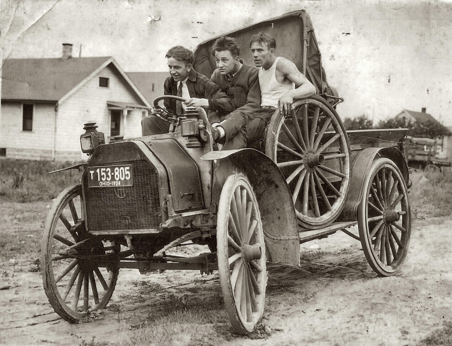 Three young buddies take a ride in their new car in 1924. 