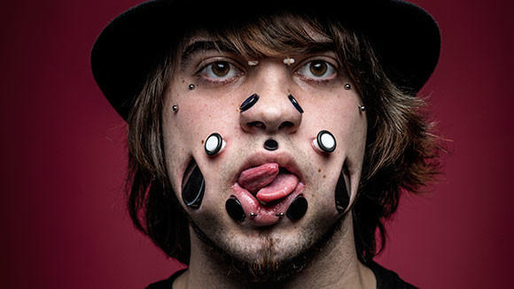 Miggler's obsession with body modification started when he got his first gauge in his ear at 13 years old.