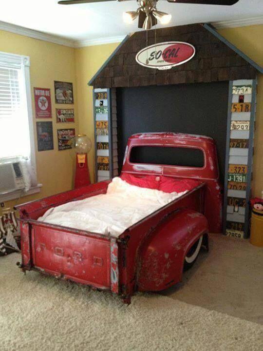 An old red pickup makes the perfect bed for a little boy's room.