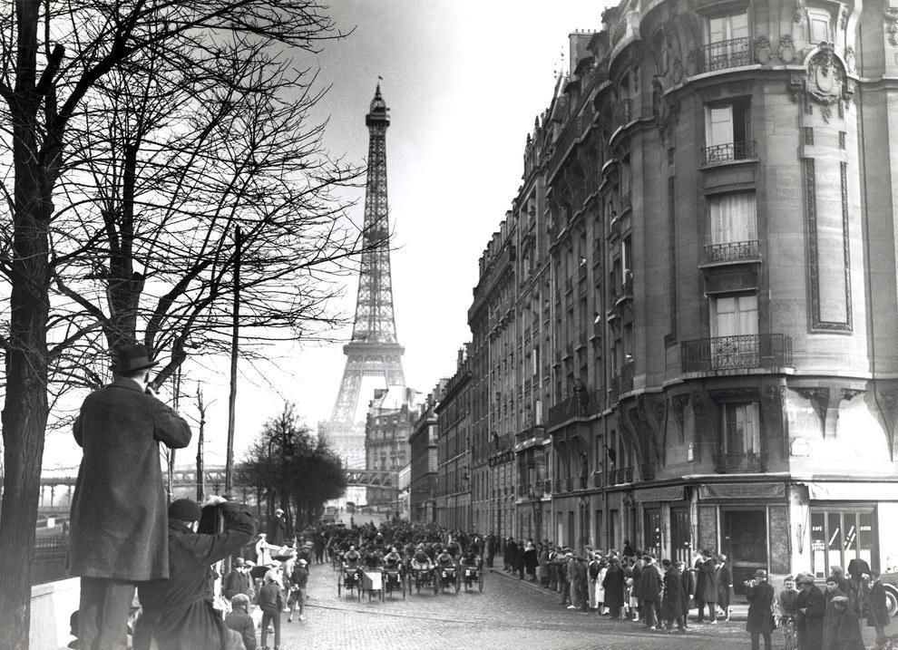 A triporteurs race through the streets of Paris, France. 