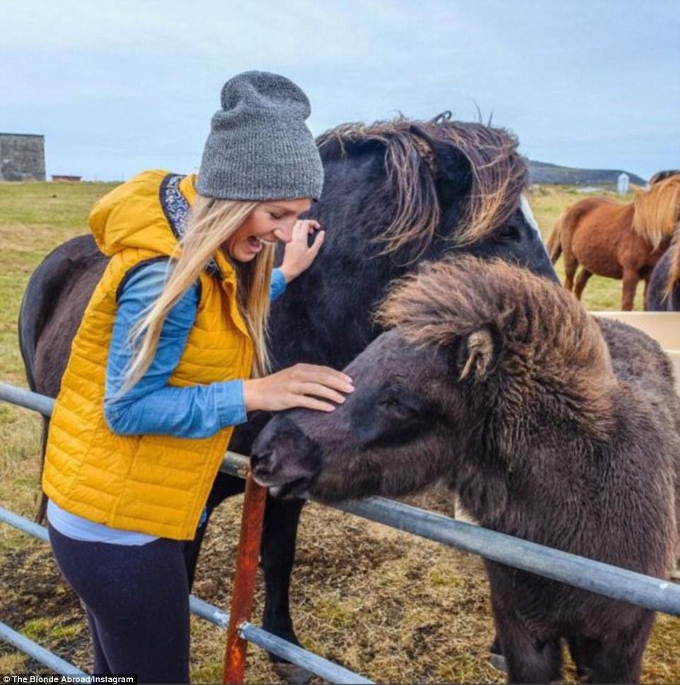 Iceland is one of her favourite countries to visit. Pictured is Rich making friends with some of the local inhabitants