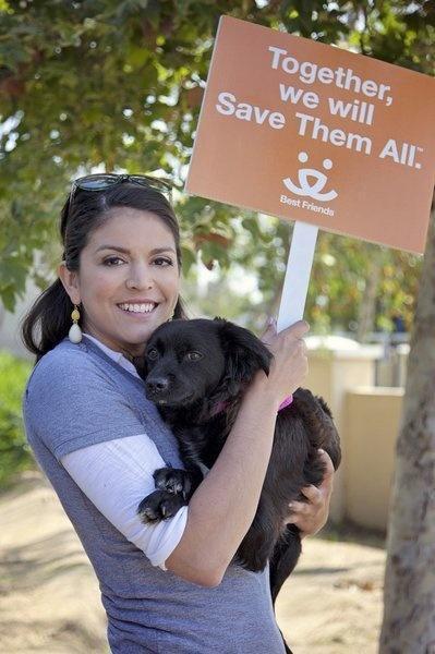 SNL's Cecily Strong holds onto her black Spaniel mix, Lucy, who she adopted from the Best Friends Pet Adoption & Spay/Neuter Center in Los Angeles