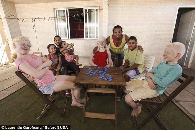 Rosamere Fernanda de Andrade, centre, thought there had been a mistake when she gave birth to a white child