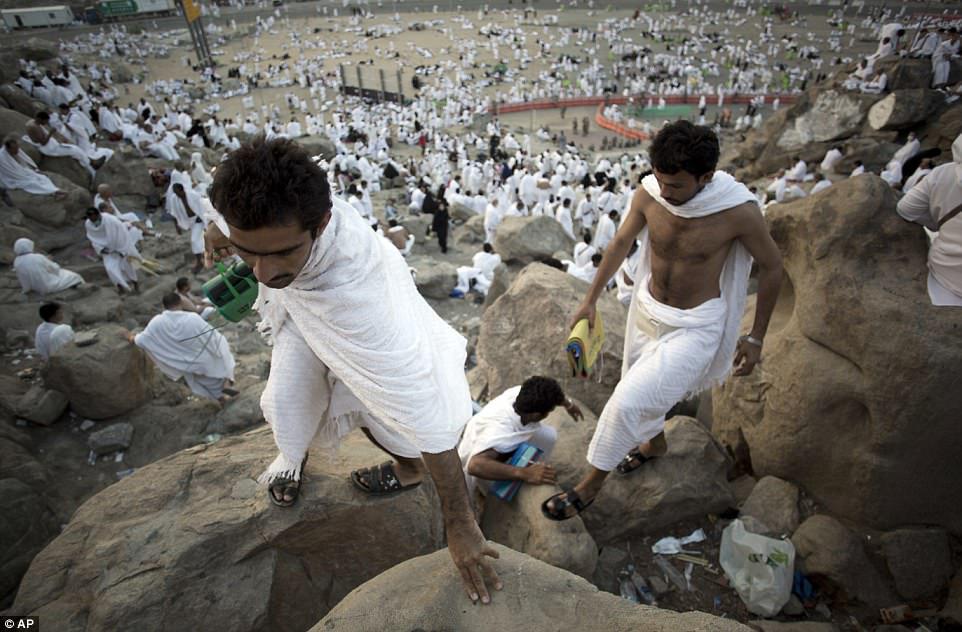 Dressed in white, the pilgrims could be seen climbing up the sides of the hill and taking up positions to pray on rocks already heated by the morning sun