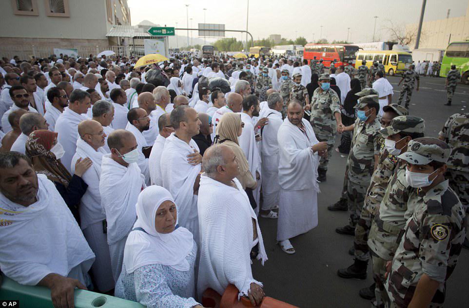 Saudi security control the traffic of the Muslim pilgrims' arrival at Arafat for the annual hajj pilgrimage, outside the holy city of Mecca, Saudi Arabia. Authorities have deployed more than 100,000 security forces to secure the hajj and assist pilgrims