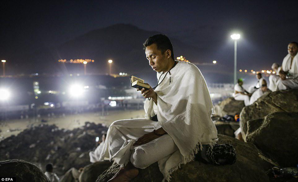 A Muslim worshipper reads the Koran during the Hajj pilgrimage on the Mount Arafat. Around 2.6 million Muslims are expected to attend this year's pilgrimage