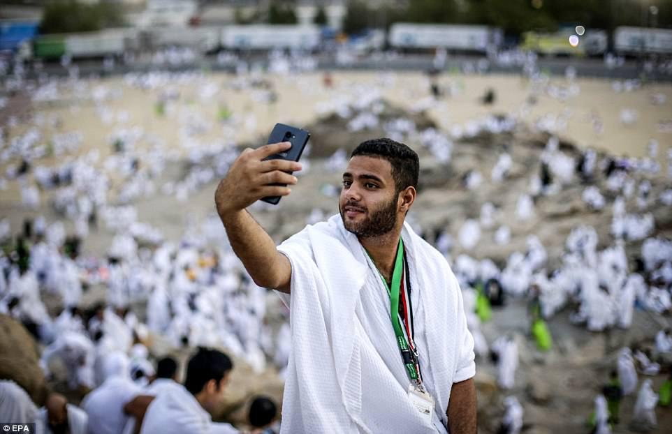 A Muslim worshipper takes selfies using his mobile phone during the Hajj pilgrimage on Mount Arafat, near Mecca, Saudi Arabia