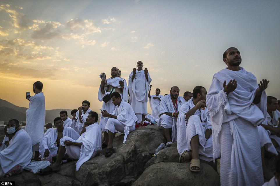Offering prayers: Muslim worshippers set off early in the morning to scale the mountain close to Mecca in Saudi Arabia