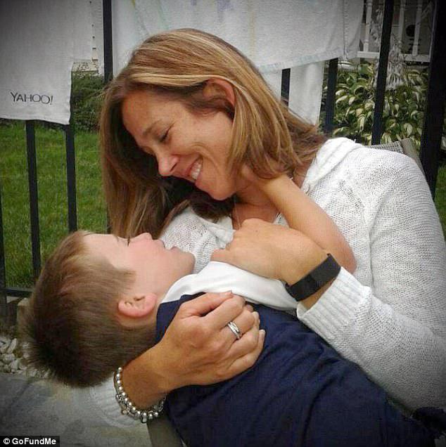 Devastating: Devin (pictured with his mother, Christine) was snowboarding with his family when he fell and hit his head. His parents just assumed he had a concussion