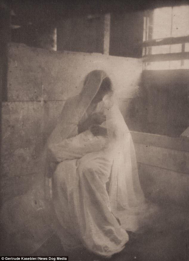 The earliest breastfeeding selfies: In a very old photograph this glamorous looking woman wears a white lace veil to feed her child
