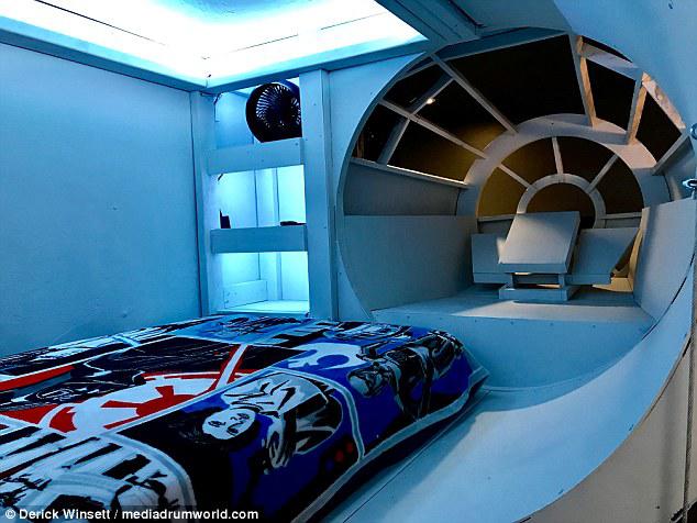 Sleeping tight: The pod-shaped bed is fitted with color-changing lights on the inside