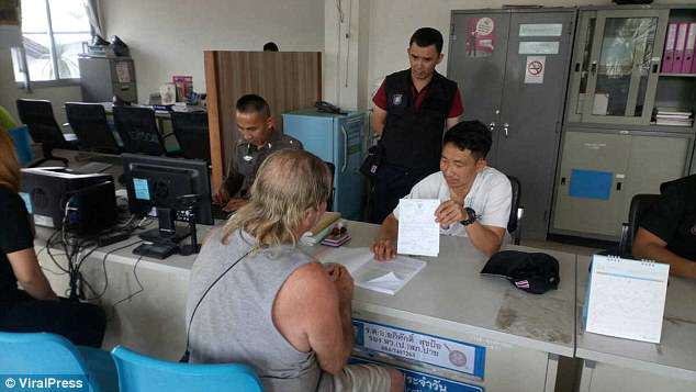 Michael Stillinger being questioned by the Thai police about the incidentÂ 