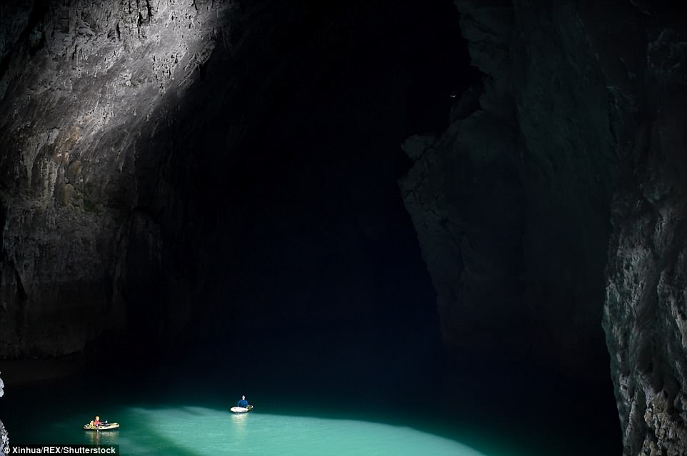 Expedition members row into the Miao Room Chamber, China's largest cave chamber by volume, in Ziyun County, Guizhou Province, south-west China. It is ranked second in surface area to the Sarawak Chamber in Malaysia