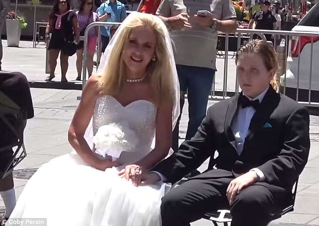 Video: A YouTuber had a 50-year-old faux bride and her 12-year-old 'groom' pretend they were taking photos in Times Square in an experiment to raise awareness against child marriage