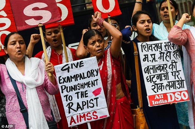 The nine year old girl's death is the latest rape scandal to hit India. Pictured: Indian women protest against rape in New Delhi in June 2018