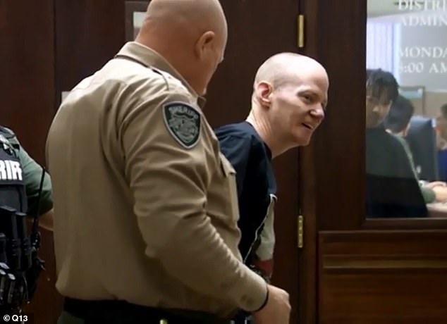 Anderson is seen being dragged out of the courtroom Monday as he became emotional over the death of his daughter HartleyÂ 