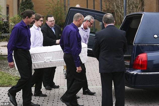 Pallbearers load Pheobe's casket into a hearse after her memorial service in January 2015