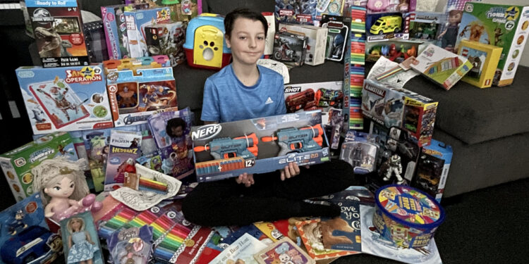 Meet the little boy who has turned into Father Christmas to collect presents for children less fortunate than him